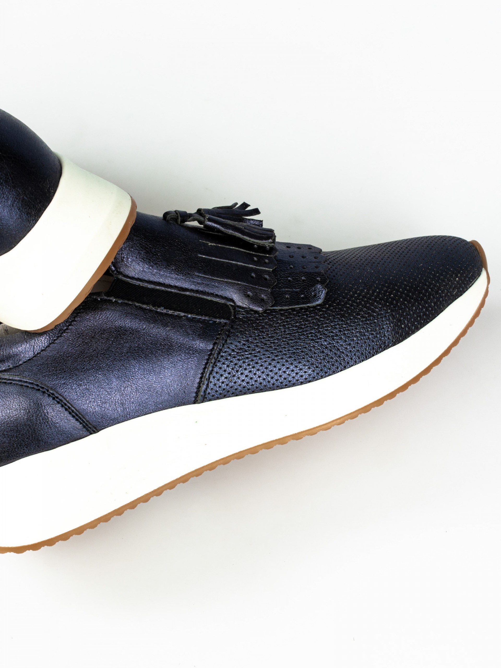 Tassel-Embellished Laminated Leather Sneakers