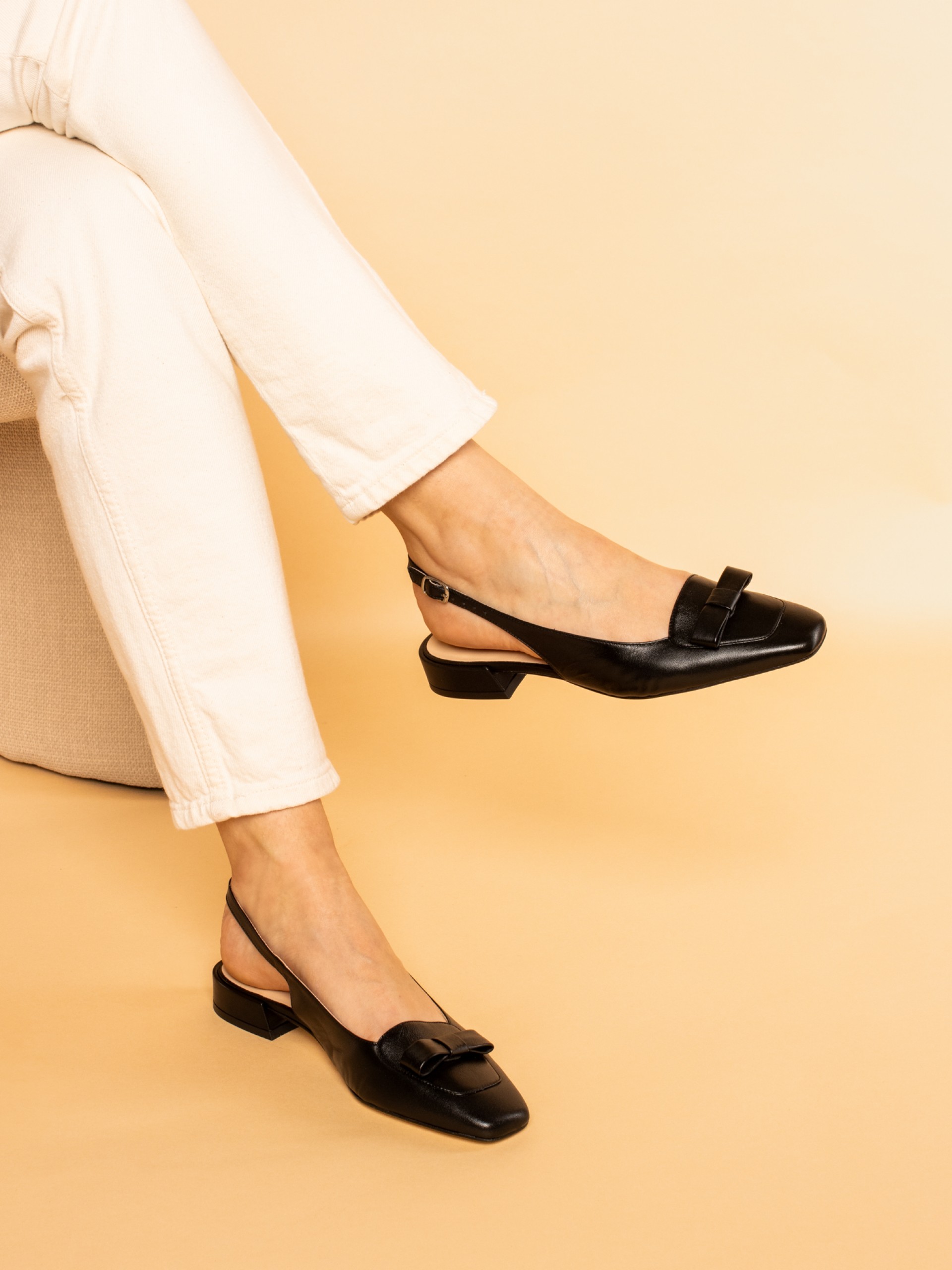 Shoe with bow and buckle detail