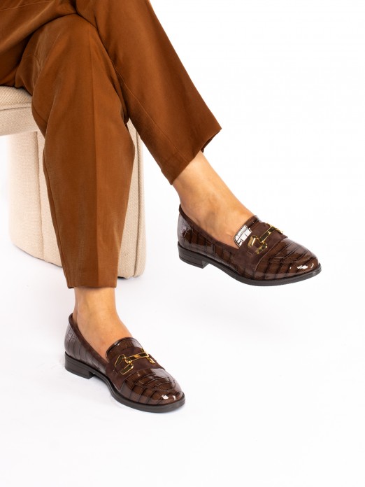 Mocassim em Verniz 
com aplicao
