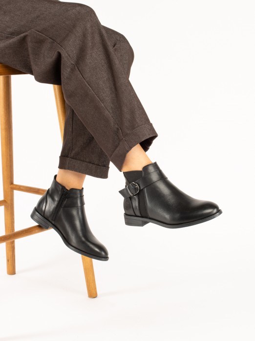 Leather ankle boot with buckle. Leather ankle boot with buckle.