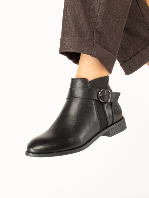 Leather ankle boot with buckle. Leather ankle boot with buckle.
