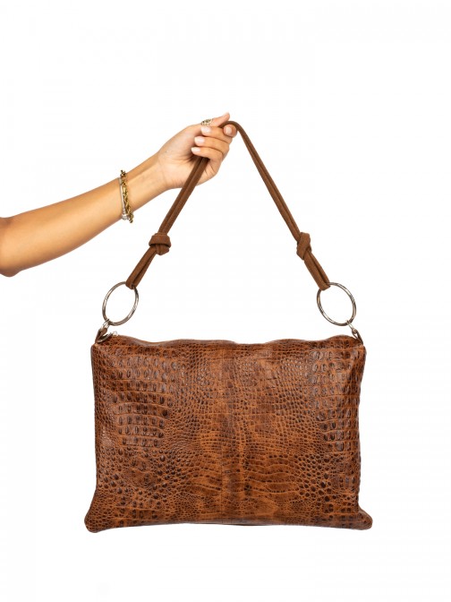 Suede and crocodile-skin shoulder bag with rings.