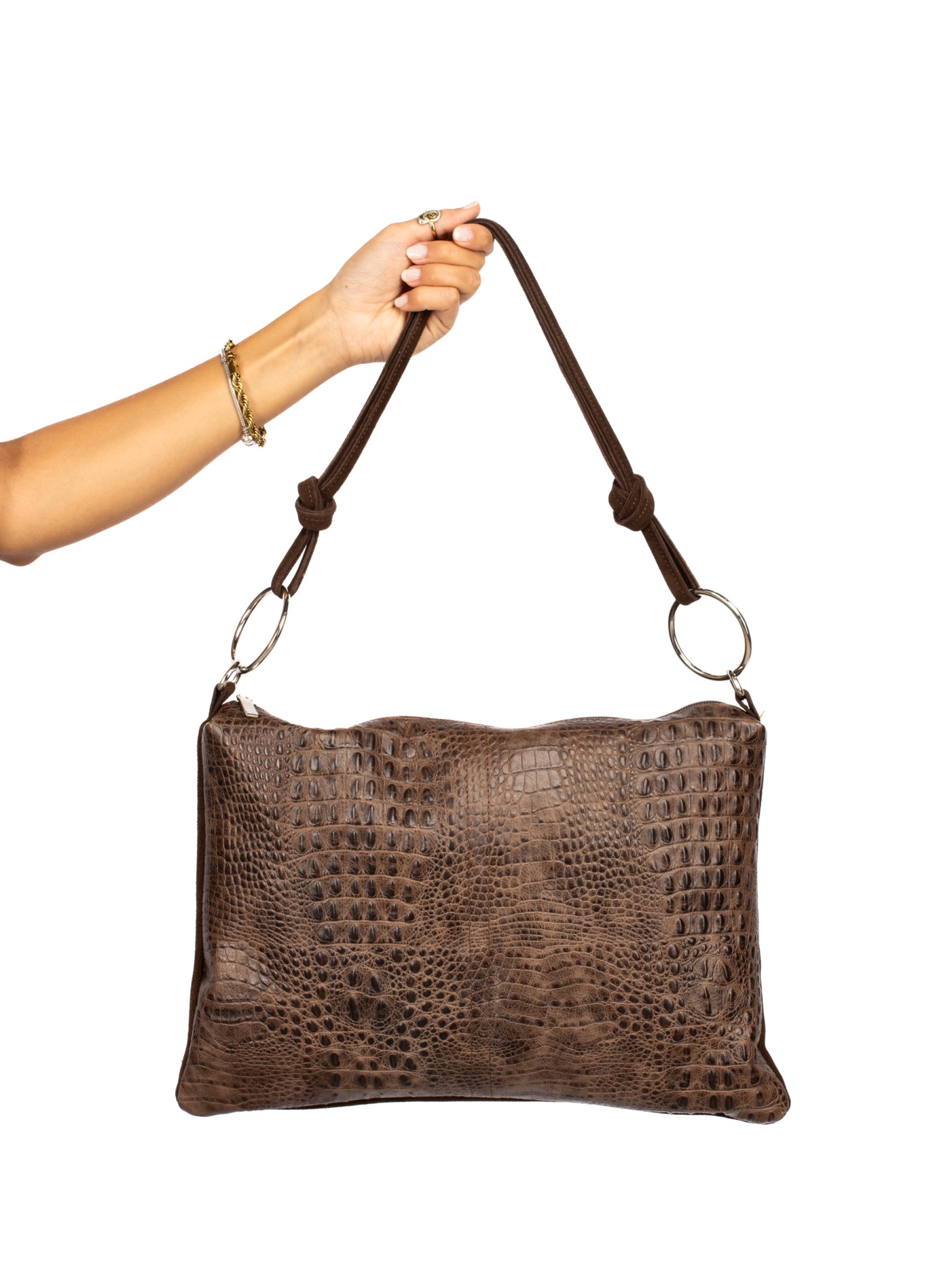 Suede and crocodile-skin shoulder bag with rings.