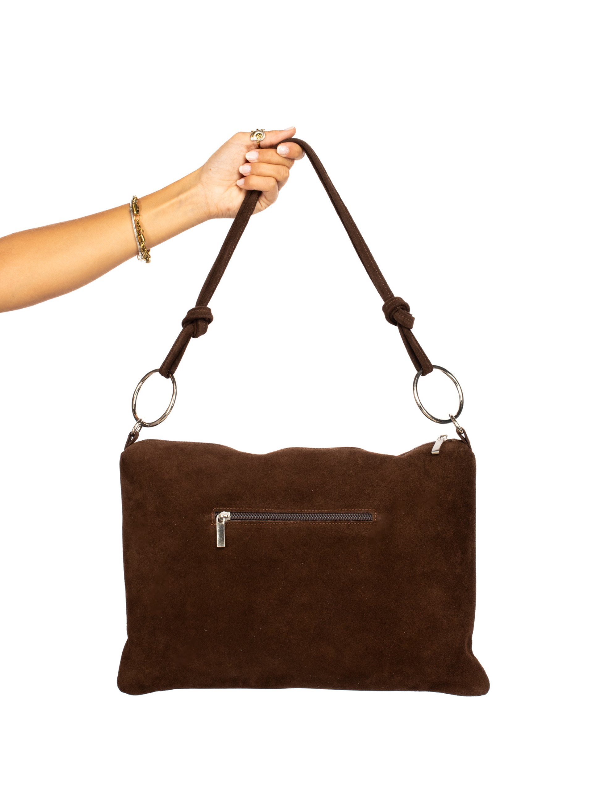 Suede shoulder bag with metal rings.