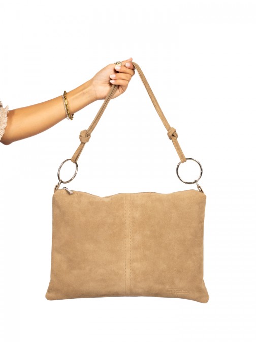Suede shoulder bag with metal rings.
